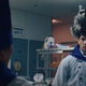 A raccoon on the head of a chef